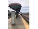 View of RTD Oxford Station platform with train approaching and station signage at 4046 S Bannock St, Englewood, CO 80110