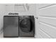 Laundry room features modern appliances and a neutral color palette at 6700 Clay St, Denver, CO 80221