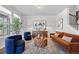 Bright and airy living room featuring stylish seating, modern decor, and hardwood floors at 6700 Clay St, Denver, CO 80221
