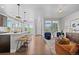 Bright living space featuring open concept kitchen and stylish living room, perfect for entertaining at 6700 Clay St, Denver, CO 80221