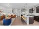 Open-concept living space seamlessly connecting the kitchen, dining, and living areas with modern decor at 6700 Clay St, Denver, CO 80221