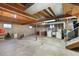 Unfinished basement with exposed wood ceiling features washer/dryer hookups and utilities at 7181 Beech St, Arvada, CO 80004