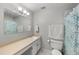 Bathroom with long countertop, sink, and vanity at 7181 Beech St, Arvada, CO 80004