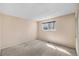 Empty bedroom with neutral carpet and large window at 7181 Beech St, Arvada, CO 80004