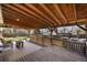 Wide plank covered patio is perfect for entertaining and outdoor living at 7181 Beech St, Arvada, CO 80004