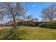 Well-maintained lawn and mature landscaping at 7181 Beech St, Arvada, CO 80004