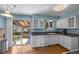 Updated kitchen with stainless steel appliances and sliding glass door to the backyard at 7181 Beech St, Arvada, CO 80004