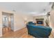 Cozy living room with hardwood floors, fireplace, and comfortable seating at 7181 Beech St, Arvada, CO 80004