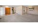 Spacious living room with stairs and ample natural light at 7181 Beech St, Arvada, CO 80004