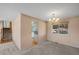 Open living room area with hardwood floors near the stairs at 7181 Beech St, Arvada, CO 80004