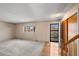 Spacious living room with large window and natural light at 7181 Beech St, Arvada, CO 80004