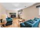 Inviting living room with a fireplace, hardwood floors, and comfortable seating at 7181 Beech St, Arvada, CO 80004