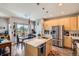 Bright kitchen with stainless steel appliances, quartz countertops, and modern cabinetry at 5328 Potentilla St, Brighton, CO 80601