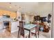 Eat-in kitchen with stainless appliances, and a modern island with sink at 5328 Potentilla St, Brighton, CO 80601