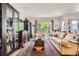 Cozy living room with hardwood floors, neutral paint, and ample natural light at 5328 Potentilla St, Brighton, CO 80601