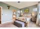A serene main bedroom featuring ensuite bathroom access and a ceiling fan at 5328 Potentilla St, Brighton, CO 80601