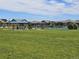 Community park with pickleball court, covered picnic area, and expansive green lawn for recreation at 5328 Potentilla St, Brighton, CO 80601