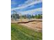 Community playground with climbing structures, swings, and a wood chip safety ground for children to enjoy at 5328 Potentilla St, Brighton, CO 80601