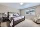 Relaxing bedroom with a comfortable bed and soft, neutral décor at 12631 Glencoe St, Thornton, CO 80241