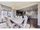 Open dining room featuring table with seating with adjacent kitchen at 12631 Glencoe St, Thornton, CO 80241