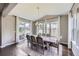 Bright dining room with a large table, chairs, and natural light at 12631 Glencoe St, Thornton, CO 80241