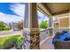 Cozy front porch showcasing stone columns and comfortable seating, ideal for relaxing outdoors at 12631 Glencoe St, Thornton, CO 80241
