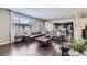Spacious living room featuring hardwood floors, a large window, and modern decor at 12631 Glencoe St, Thornton, CO 80241