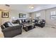 Comfortable living room featuring with cozy leather furniture at 12631 Glencoe St, Thornton, CO 80241