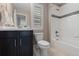 Bright bathroom featuring tiled floors, a modern vanity, and a shower-tub combo at 4545 S Monaco St # 328, Denver, CO 80237