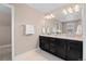 Bright bathroom featuring a double vanity and ample counter space and storage at 4545 S Monaco St # 328, Denver, CO 80237