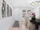 Bright dining room with a modern chandelier, a dining table, and a doorway at 4545 S Monaco St # 328, Denver, CO 80237