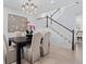 Elegant dining room featuring a modern chandelier, staircase, and ample natural light at 4545 S Monaco St # 328, Denver, CO 80237