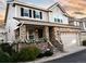 Inviting home showcasing a brick front, an attached two-car garage, and a charming porch with flower boxes at 4545 S Monaco St # 328, Denver, CO 80237