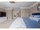 Bright main bedroom with ample space, neutral walls, and a plush carpet at 4545 S Monaco St # 328, Denver, CO 80237