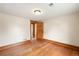 An empty bedroom with hardwood floors, natural wood trim, and bright natural light at 276 N 5Th Ave, Brighton, CO 80601