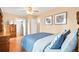 Bedroom featuring hardwood floors, a ceiling fan, and a classic wood dresser for ample storage at 276 N 5Th Ave, Brighton, CO 80601