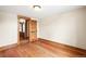 An empty bedroom with hardwood floors, natural wood trim, and bright natural light at 276 N 5Th Ave, Brighton, CO 80601