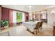 Bright dining room with large window and view to a large yard and neighborhood at 276 N 5Th Ave, Brighton, CO 80601