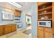 Charming kitchen equipped with a white range and a convenient microwave shelf; cozy and functional at 276 N 5Th Ave, Brighton, CO 80601