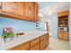 Kitchen showing lots of storage with long countertops and vintage wood cabinets at 276 N 5Th Ave, Brighton, CO 80601