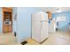 Spacious laundry room area located in the kitchen, next to the vintage refrigerator at 276 N 5Th Ave, Brighton, CO 80601