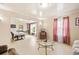 Cozy living room featuring natural light, neutral walls and a seamless connection to the dining area at 276 N 5Th Ave, Brighton, CO 80601