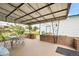 This covered patio includes an outdoor dining table, perfect for entertaining guests at 276 N 5Th Ave, Brighton, CO 80601