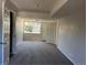 Finished basement area featuring neutral paint and carpet, plus a window for natural light at 12252 Elmendorf Pl, Denver, CO 80239