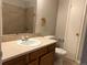 Neutral bathroom featuring a vanity with an oval sink and a shower with tiled walls at 12252 Elmendorf Pl, Denver, CO 80239