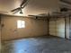 Two car garage offers lighting and space for storage; a convenient area at 12252 Elmendorf Pl, Denver, CO 80239
