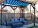 Backyard oasis with a pergola, built-in seating, and a cozy fire pit at 1847 W 41St Ave, Denver, CO 80211