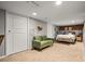 Finished basement with neutral carpet, recessed lighting, and exposed brick accent wall at 1847 W 41St Ave, Denver, CO 80211