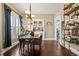 Elegant dining room featuring a wood table, stylish chairs, and a built-in cabinet at 1847 W 41St Ave, Denver, CO 80211