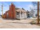 Charming exterior view of a well-maintained home with a classic brick facade and inviting front porch at 1847 W 41St Ave, Denver, CO 80211